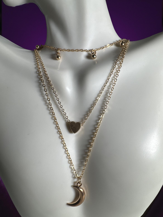 Gold necklace with beads, heart and  moon pendants
